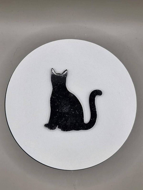 Zwarte kat, zittend