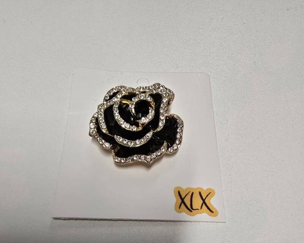Broche Roos Zwart met giltter