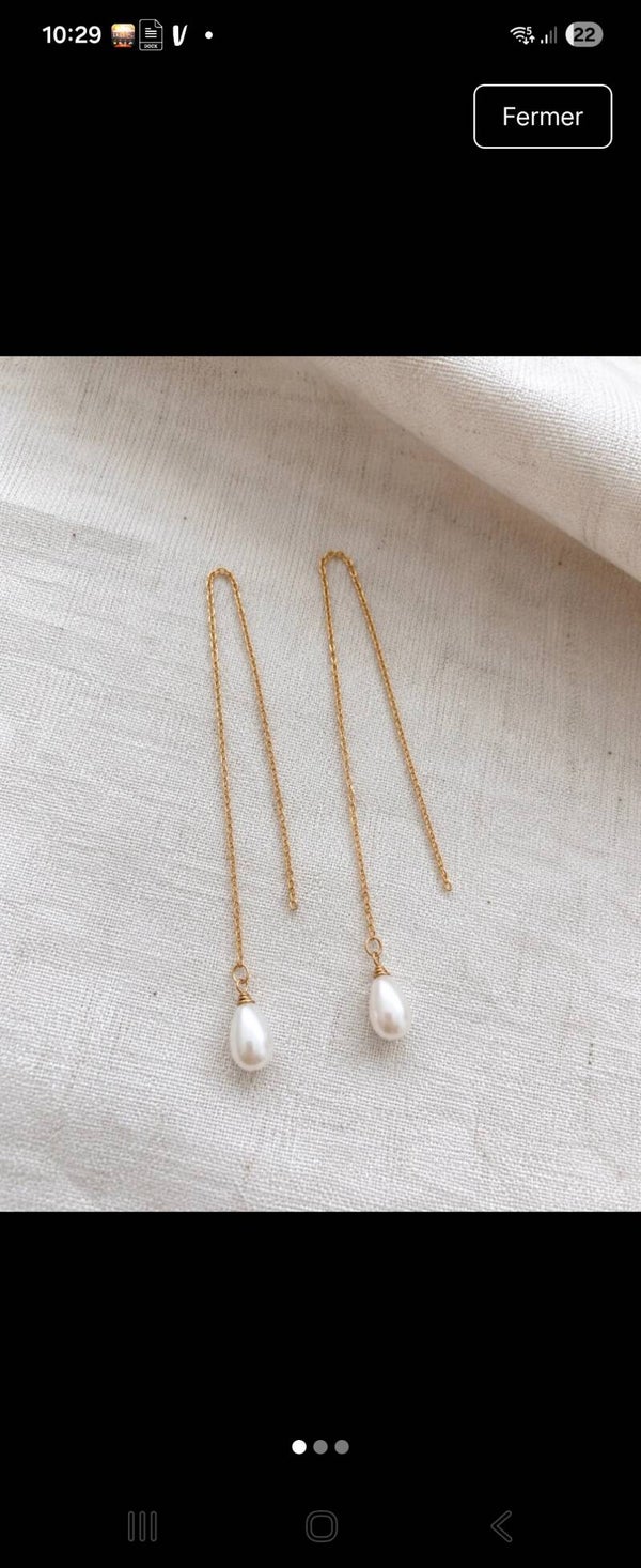 Boucles d'oreilles fil traversant en perle de culture.