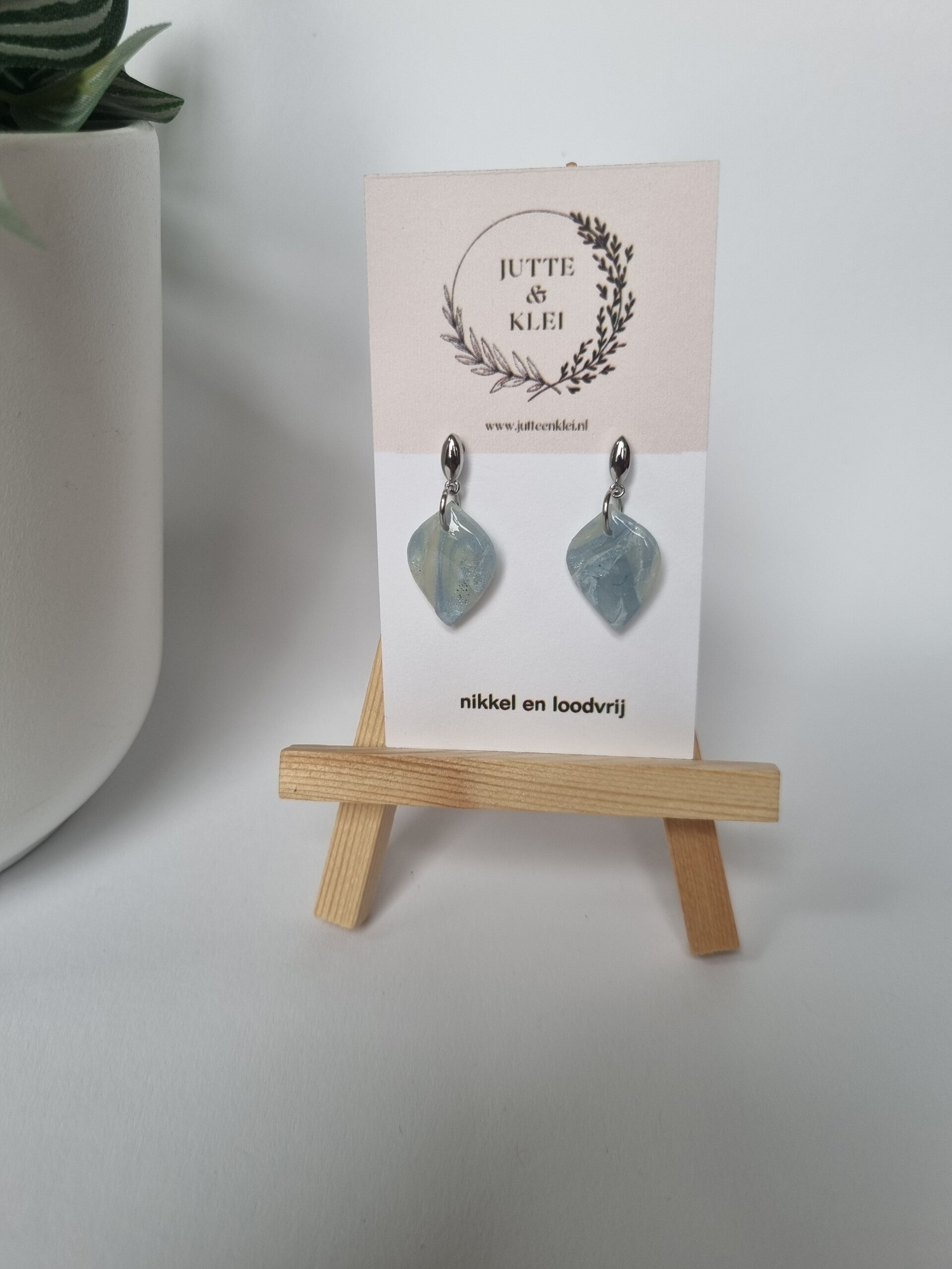 Lichtblauw zilver knopje