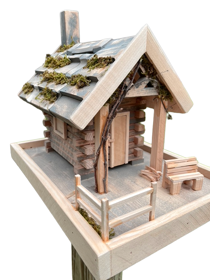 Bird feeder is handmade w/porch, moss, vines, cedar