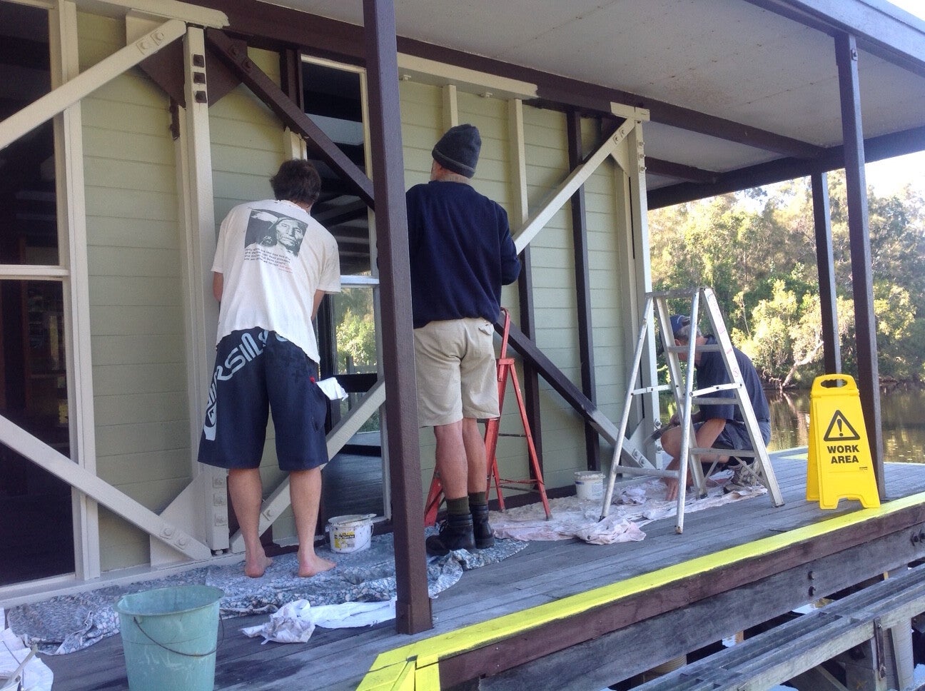 Volunteers painting the Kinaba Information Centre