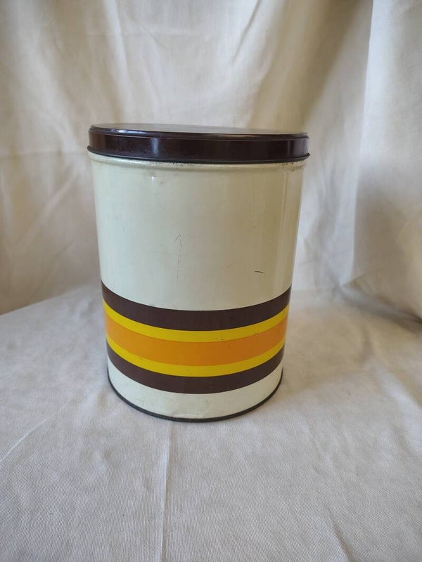 Vintage Impala voorraadblik jaren 70 – retro blik met oranje, geel en bruin strependesign – Holland