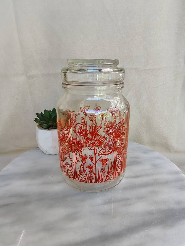Vintage glazen voorraadpot met retro bloemenprint – kruidenpot jaren 70