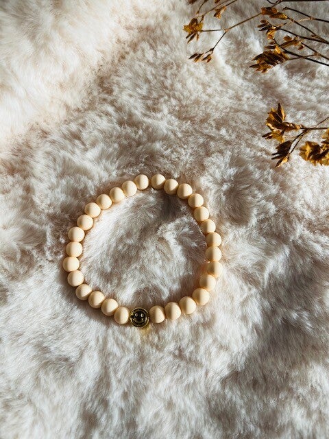 Kinderarmbandje peach smiley