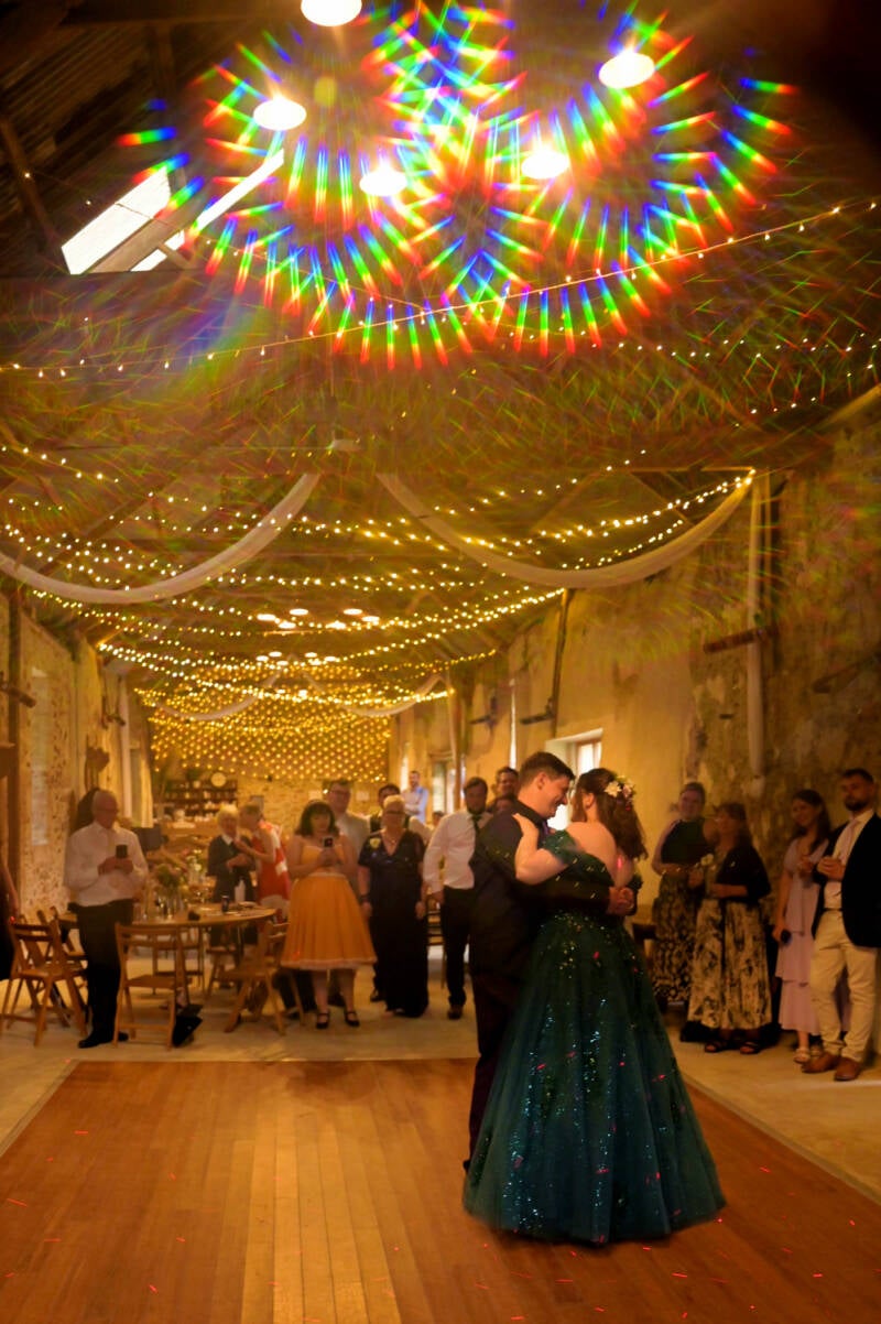 creative lighting on a couples first dance 