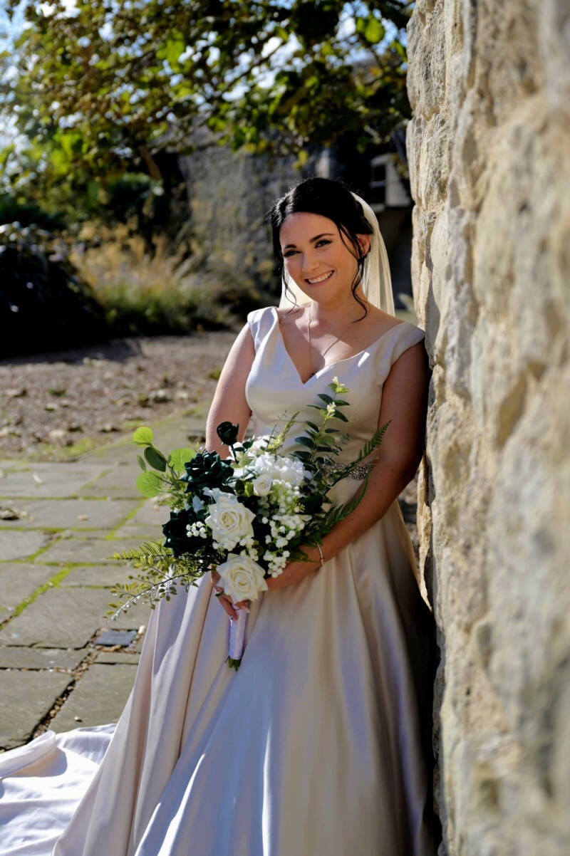 bridal portrait by the old sandstone brick