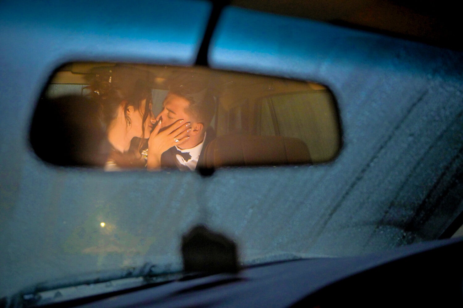 couple wedding photos in the car on a rainy day at the Quorn Grange Hotel