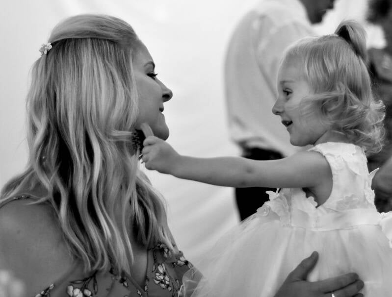 brushing mummies hair at the wedding 