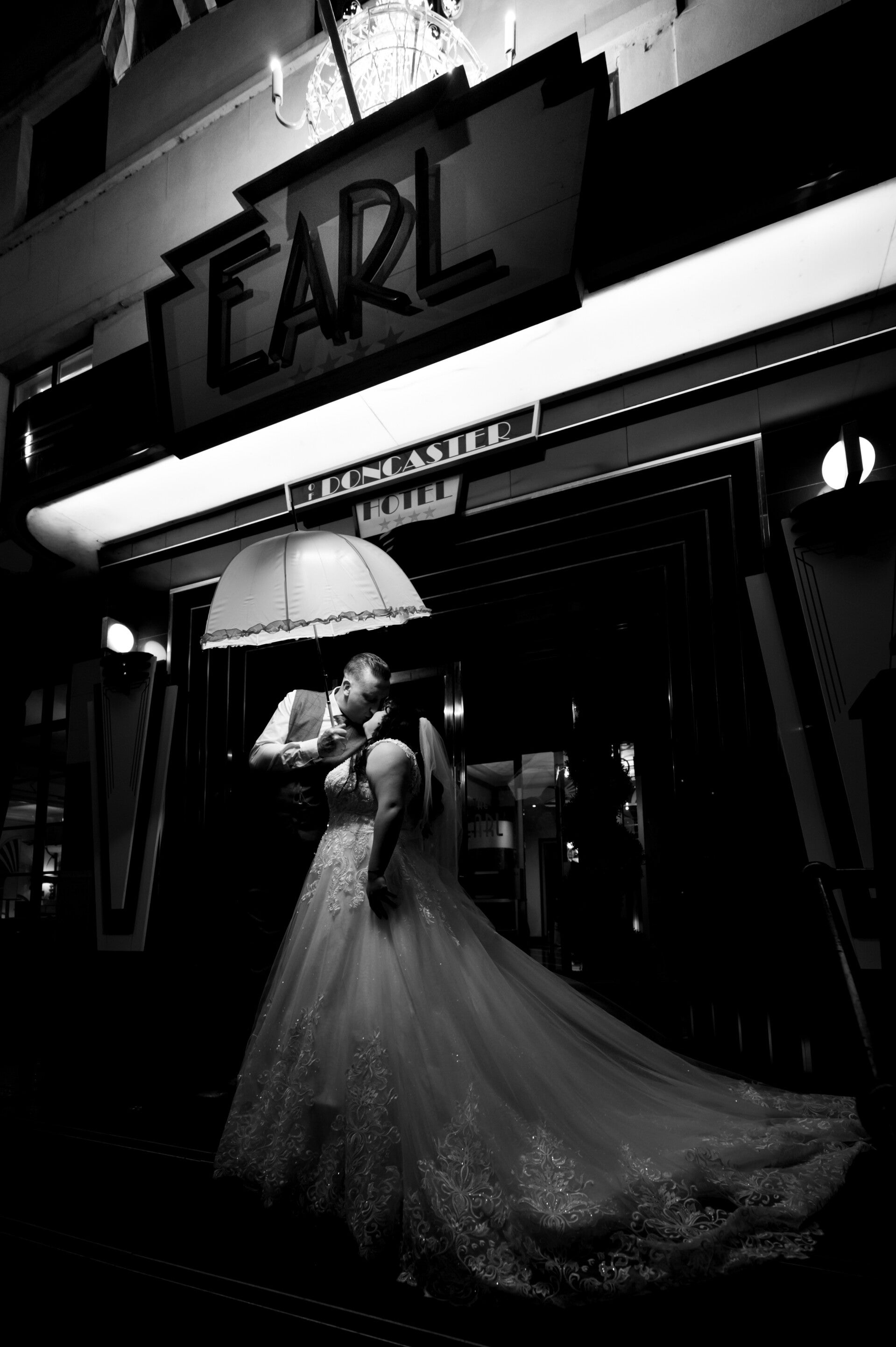 creative couple wedding photo outside earl of doncaster