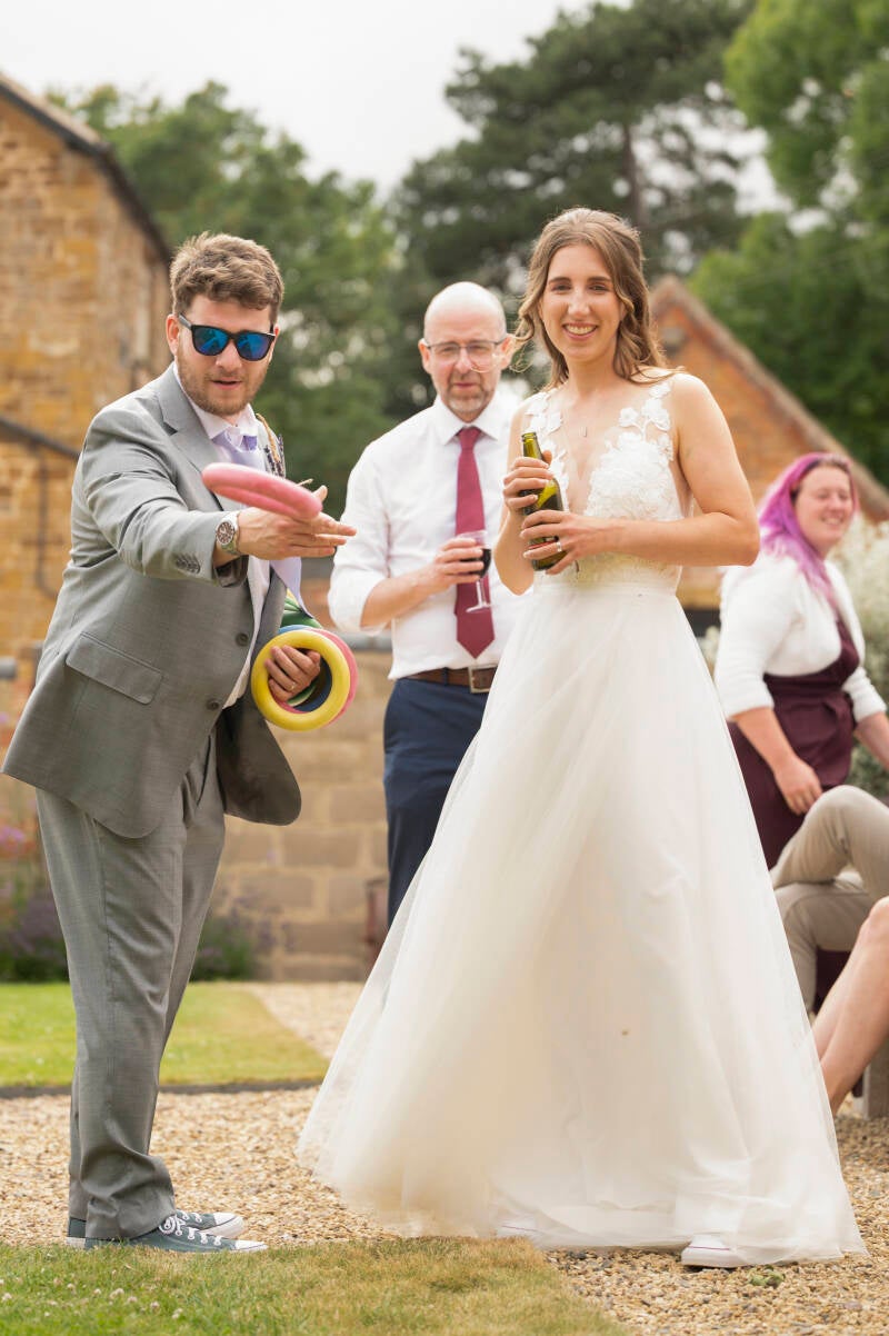 bride and groom playing graden games
