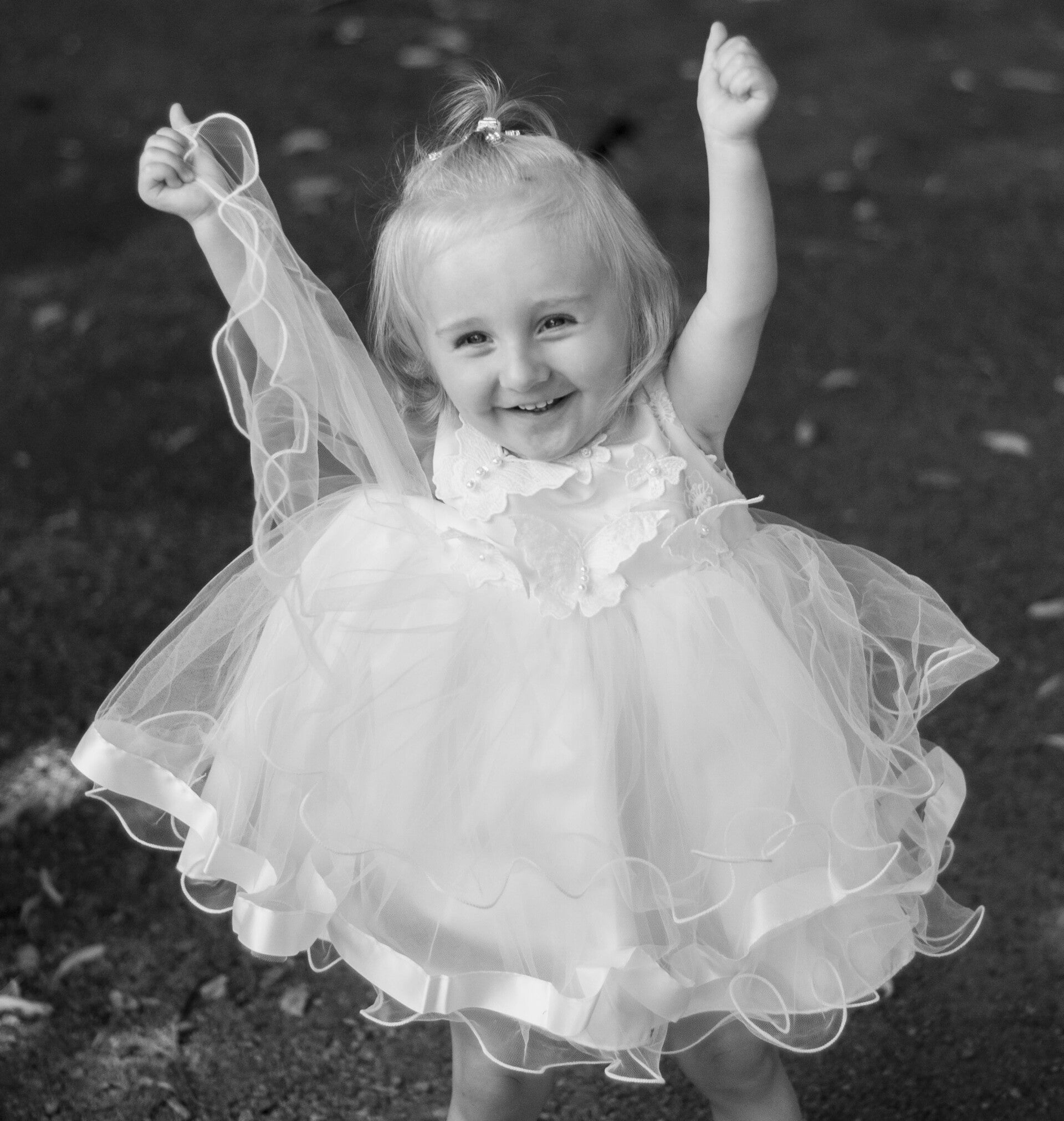 flower girl cheering at a wedding