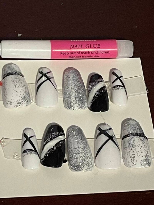 Elegant glitter, white, and black nails with glue