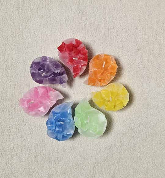 Regenboog drijfkaarsen (1 set van 7 drijfkaarsen)