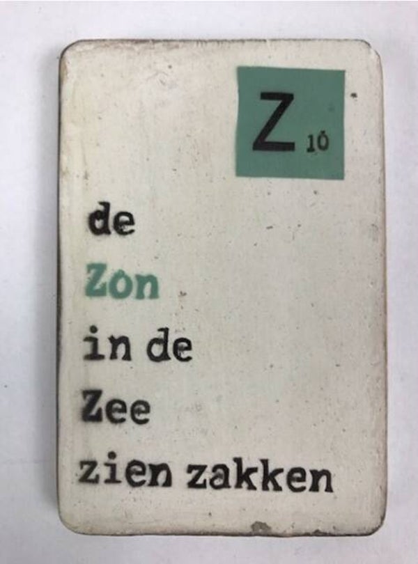 De Zon in de zee zien zakken - scrabble magneet