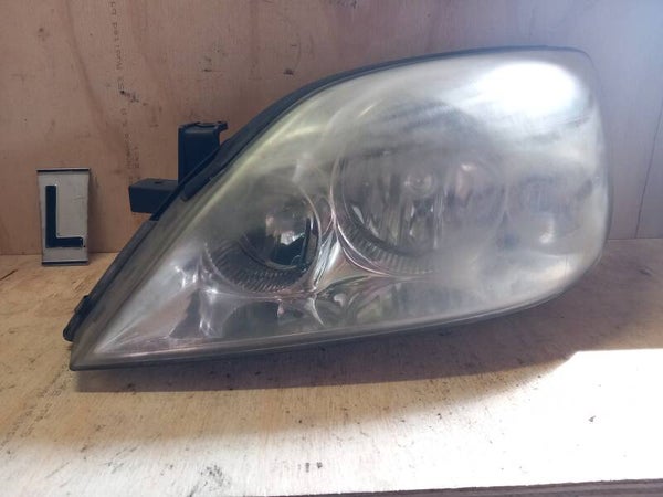 Nissan Primera III Koplamp Links HELLA 26060AU800 2002-2009