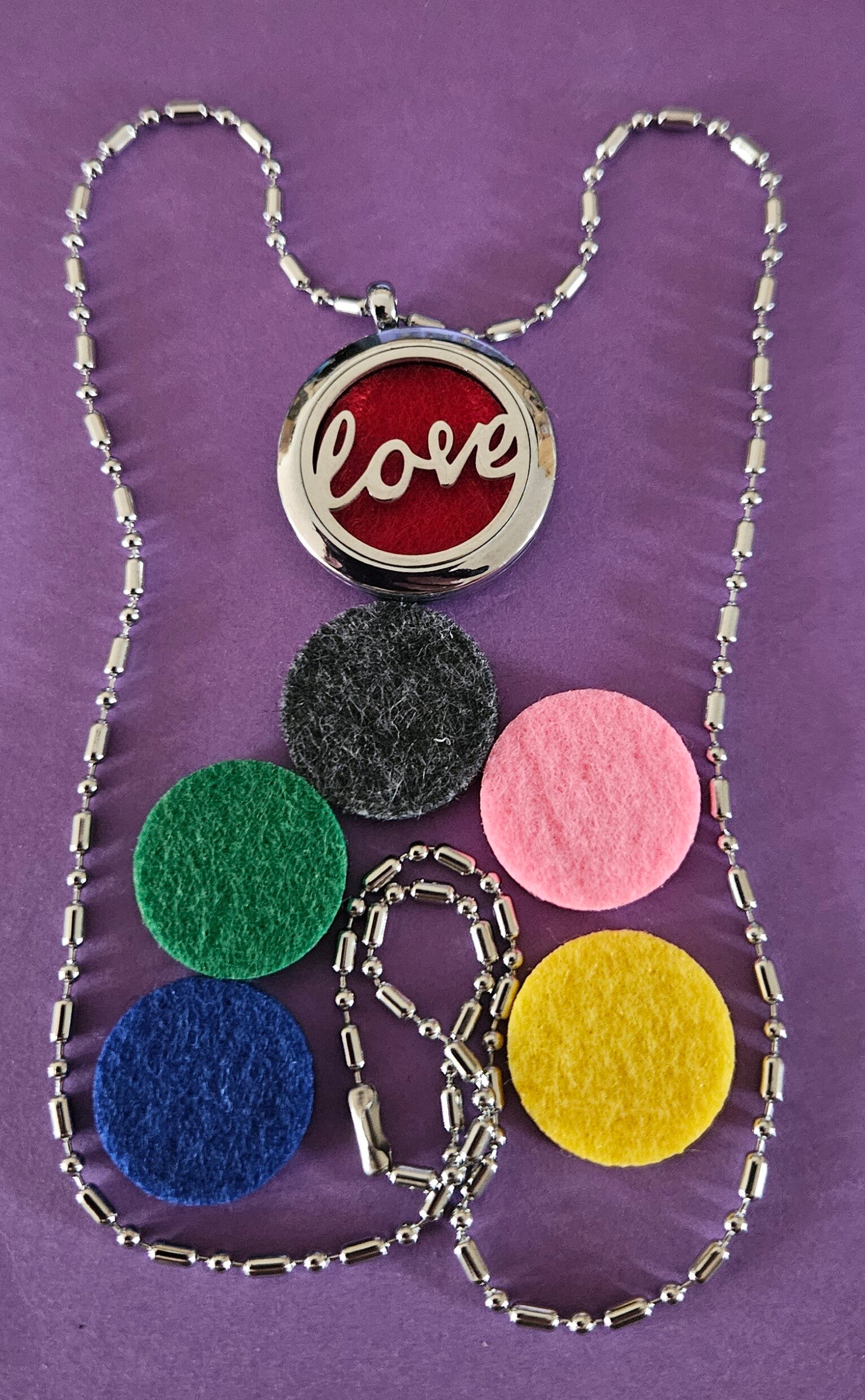 geurhanger met Love met pads
