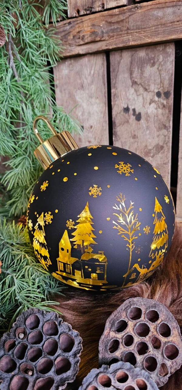 Roterende zwarte kerstbal met verlichting
