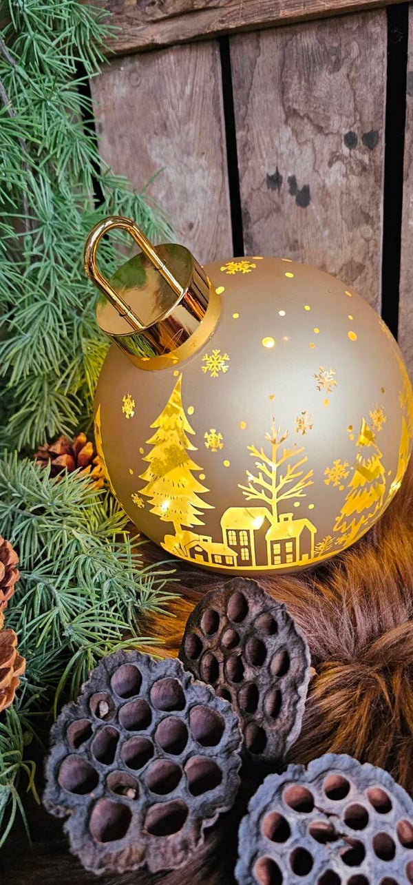 Roterende gouden kerstbal met verlichting