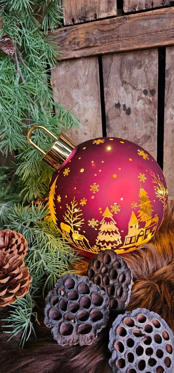 Roterende rode kerstbal met verlichting
