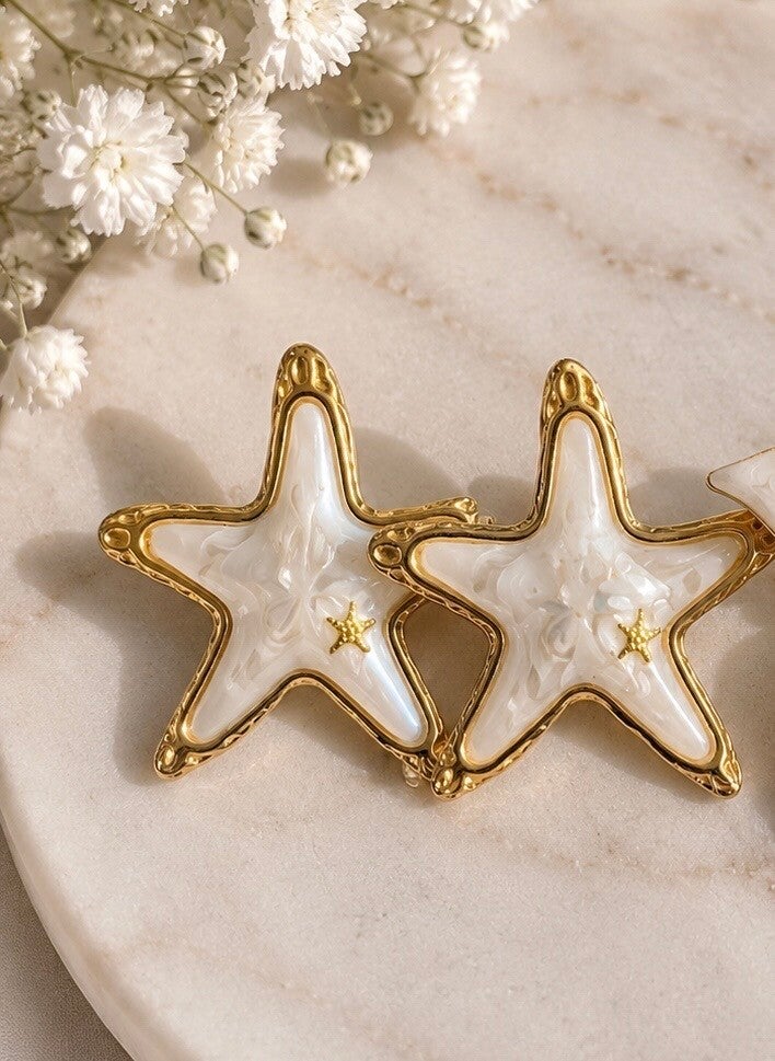 Boucles d'oreilles étoile blanche