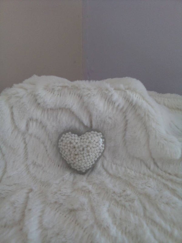 A clear white beads silver glitter resin love heart.