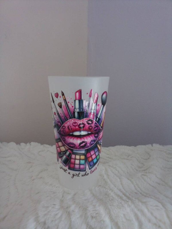 A clear plastic tumbler with design just for girls