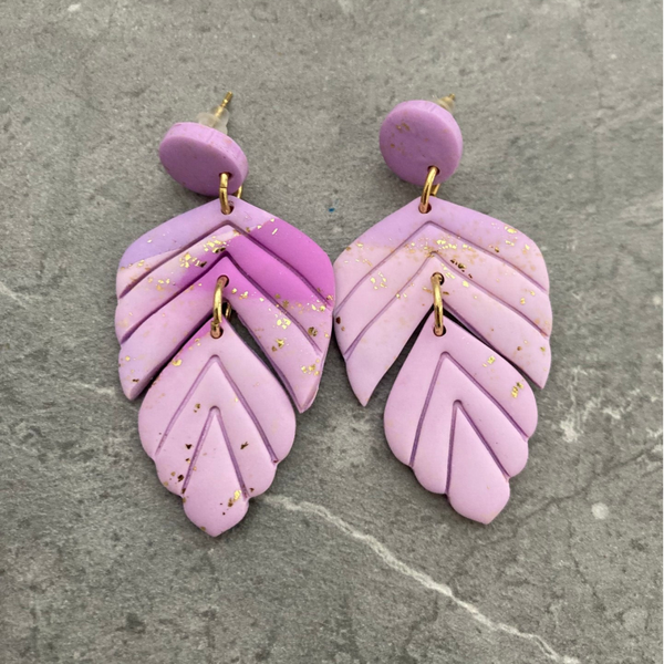 Oorbellen lila goud knopje