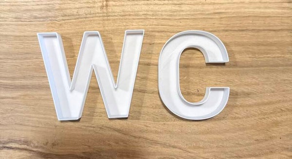 Moosbuchstaben „WC“