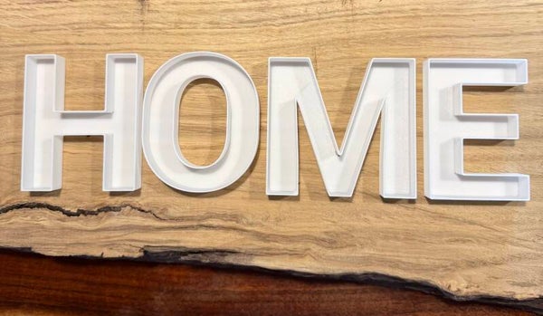 Moosbuchstaben „HOME“
