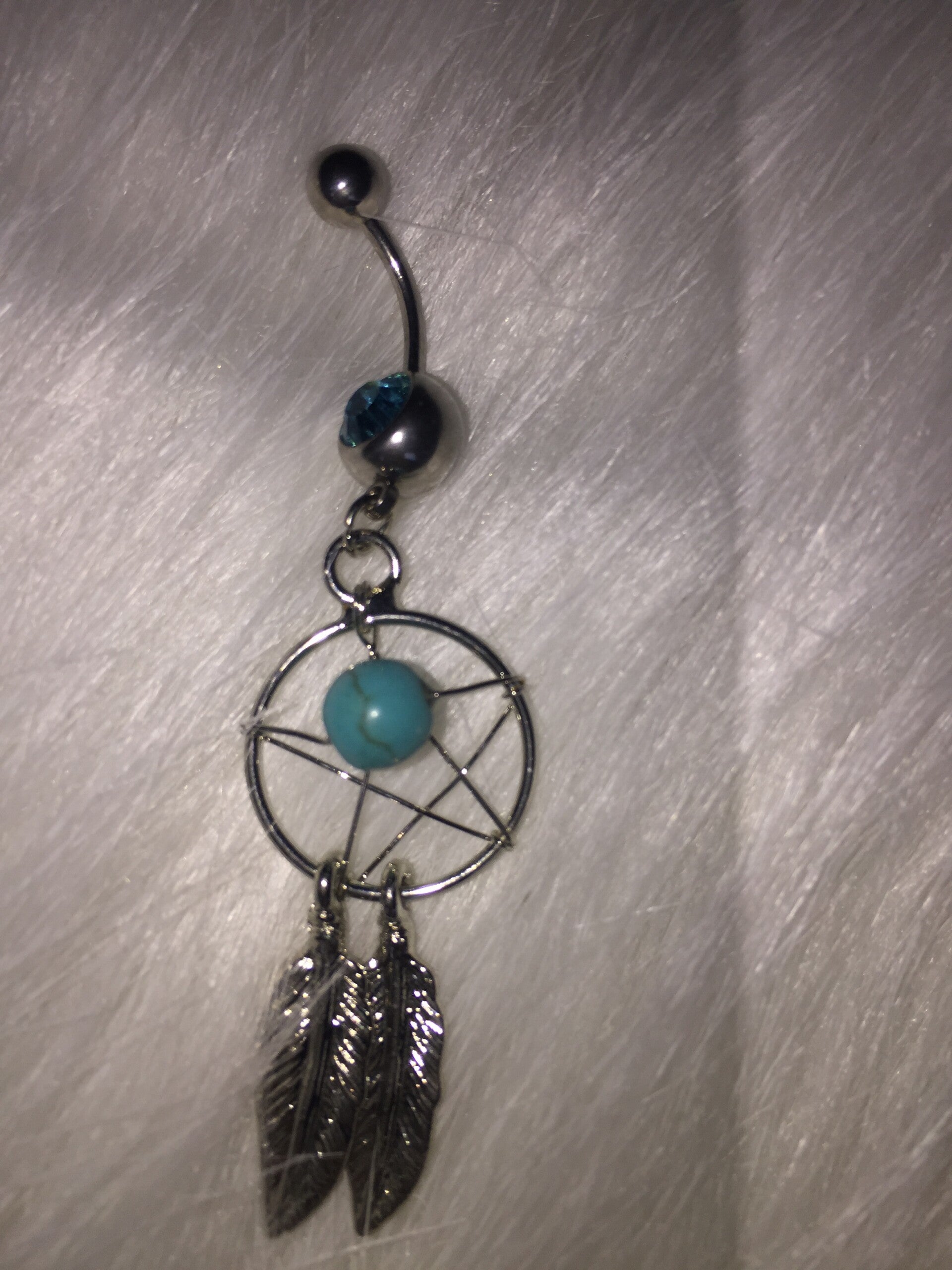 Dromenvanger navel piercing