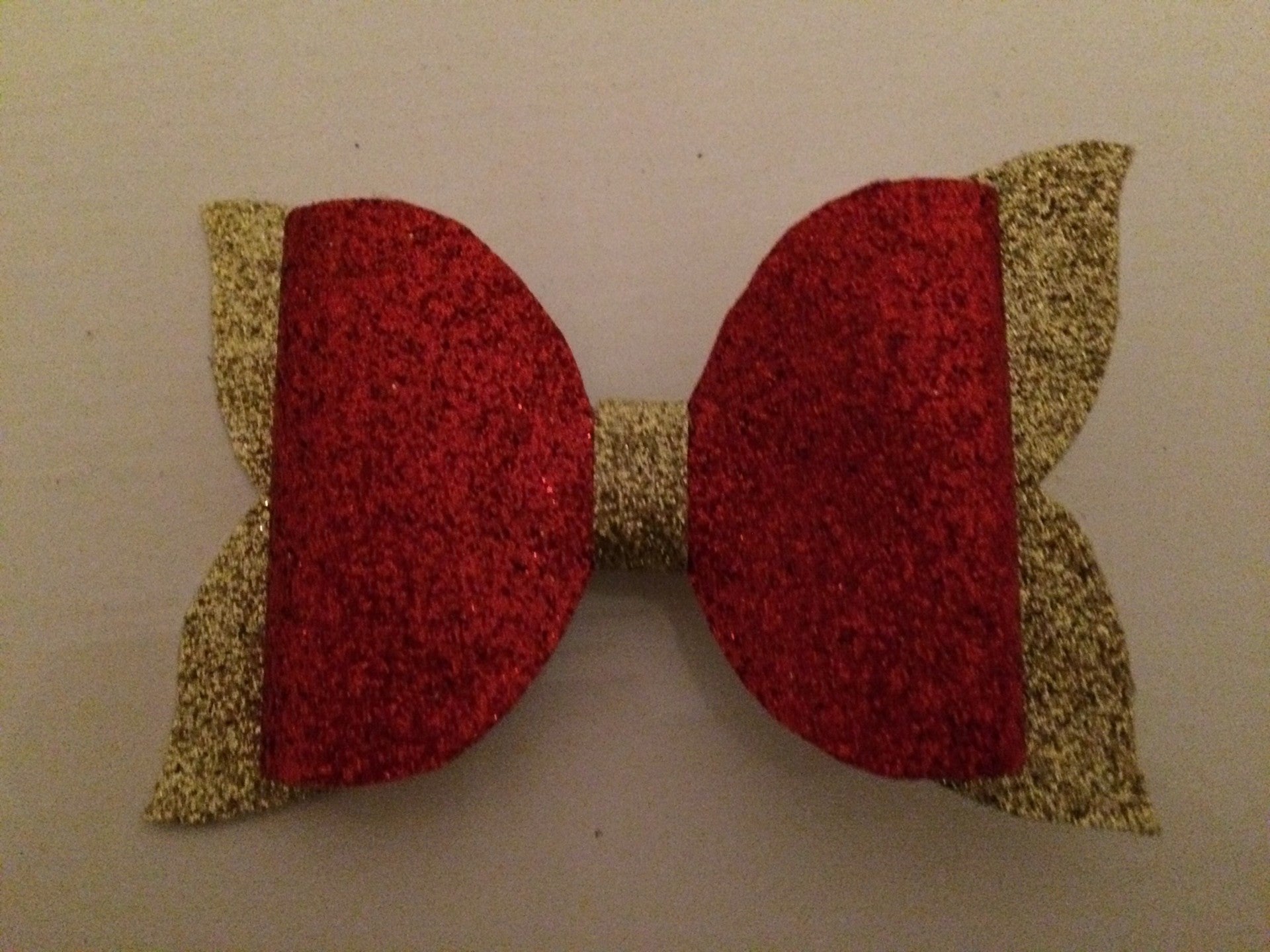 Grote strik met goud en rood