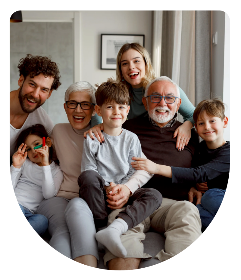 Multi-generational family smiling together, representing the peace of mind final expense insurance provides