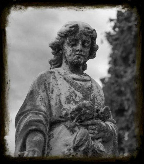 Old statue in cemetery with patina, illustrating the importance of final expense insurance and end-of-life planning