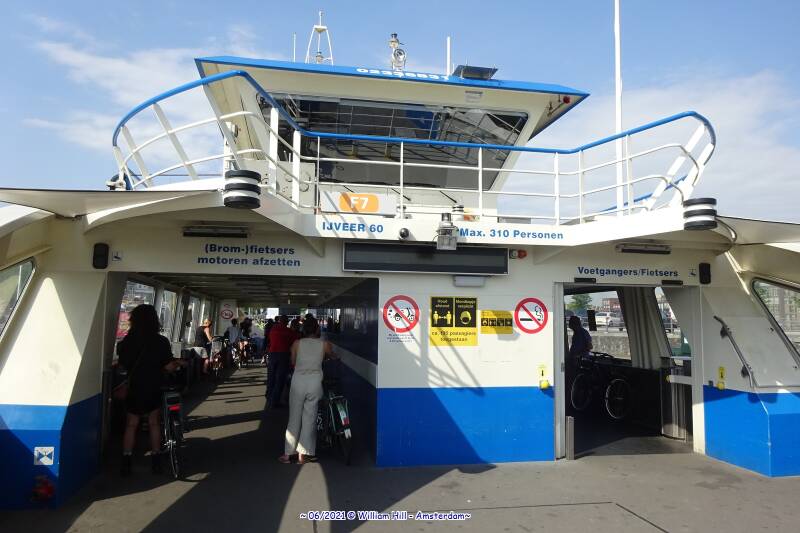 all in line to exit the ferry as soon as it arrives and the flap goes down