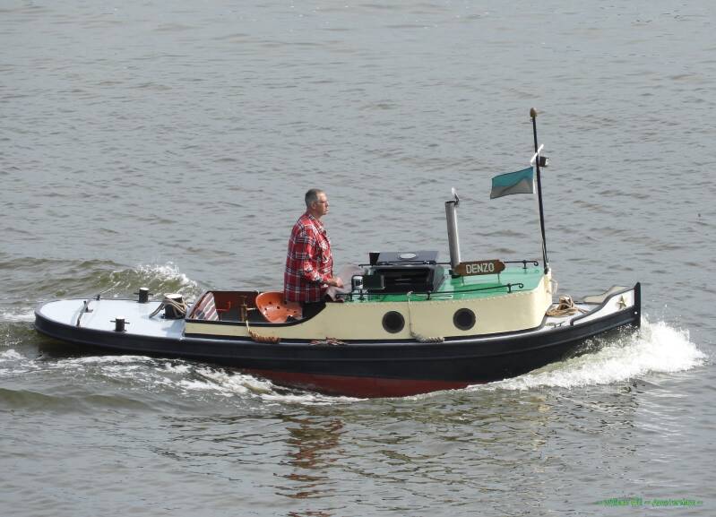 (12) a tiny pleasureboat/tug DENZO
