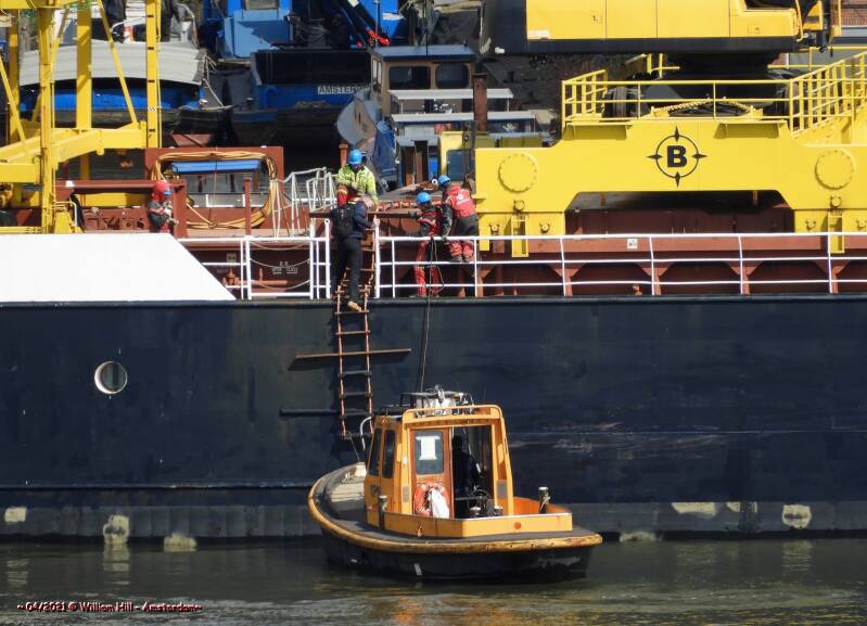 ..waiting for the harbor_pilot to give him a lift to the next job 