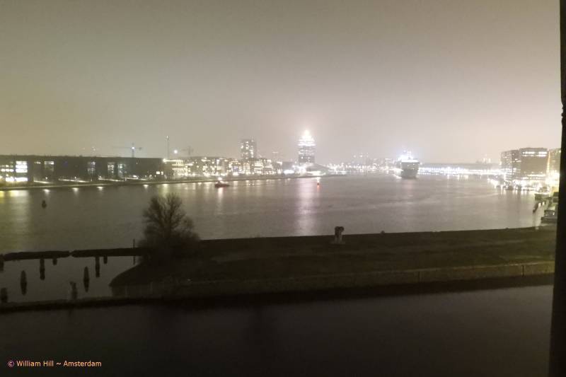 after 19:00, the ARCADIA is departing from a foggy Amsterdam