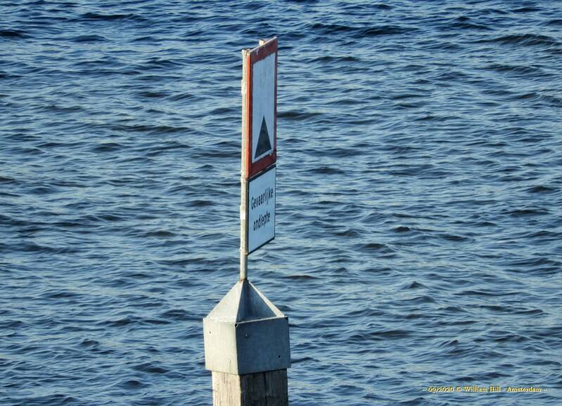 an exam failure.. yellow buoys all around the area and three signs with this warning saying: DANGEROUS SHALLOW in Dutch