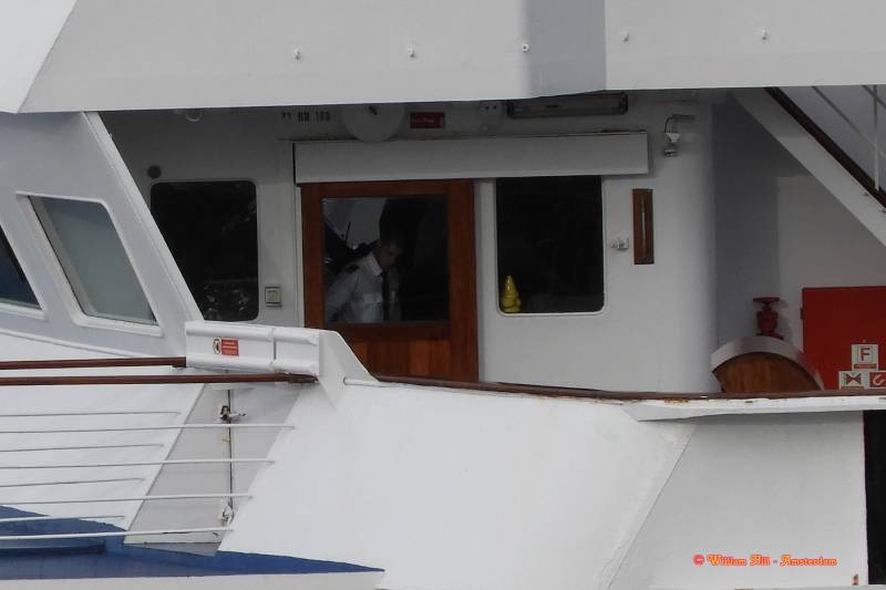 ooh, a tough captain..looking down like the captains on big ships do..  looking to the door lock..?  hahaahahaa