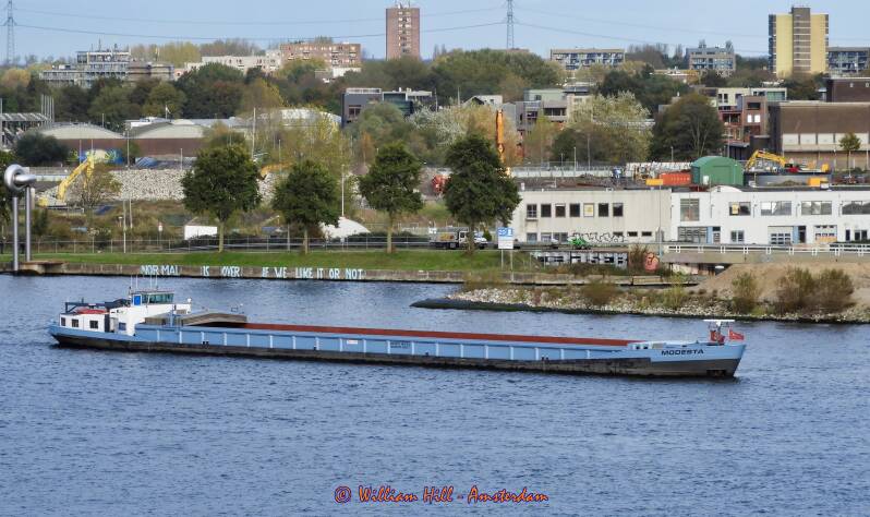 MODESTA waiting with the cargo previously transhipped by the KVITSAND, to lighten the ship needed to get here. Now waiting for KVITSAND to leave to take her place.