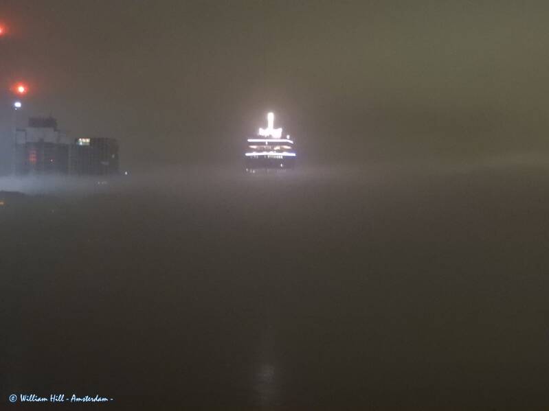 the tower behind a wall of fog
