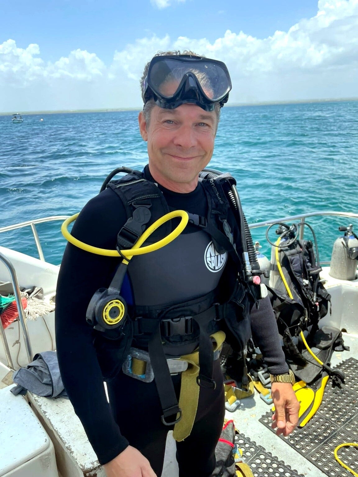 Scuba diver on a boat ready for Catalina Island diving from Punta Cana
