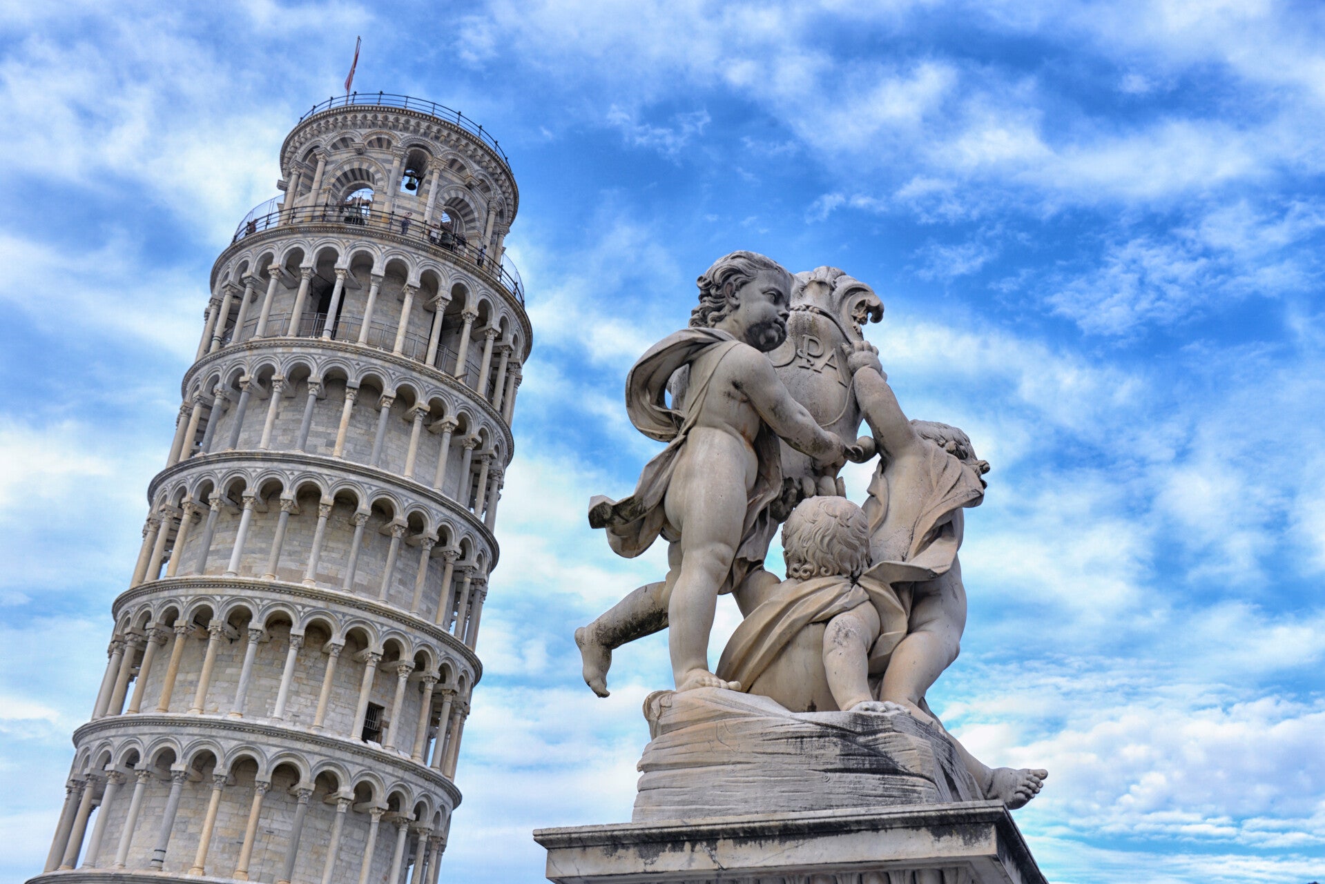 leaning tower of pisa and statue rome