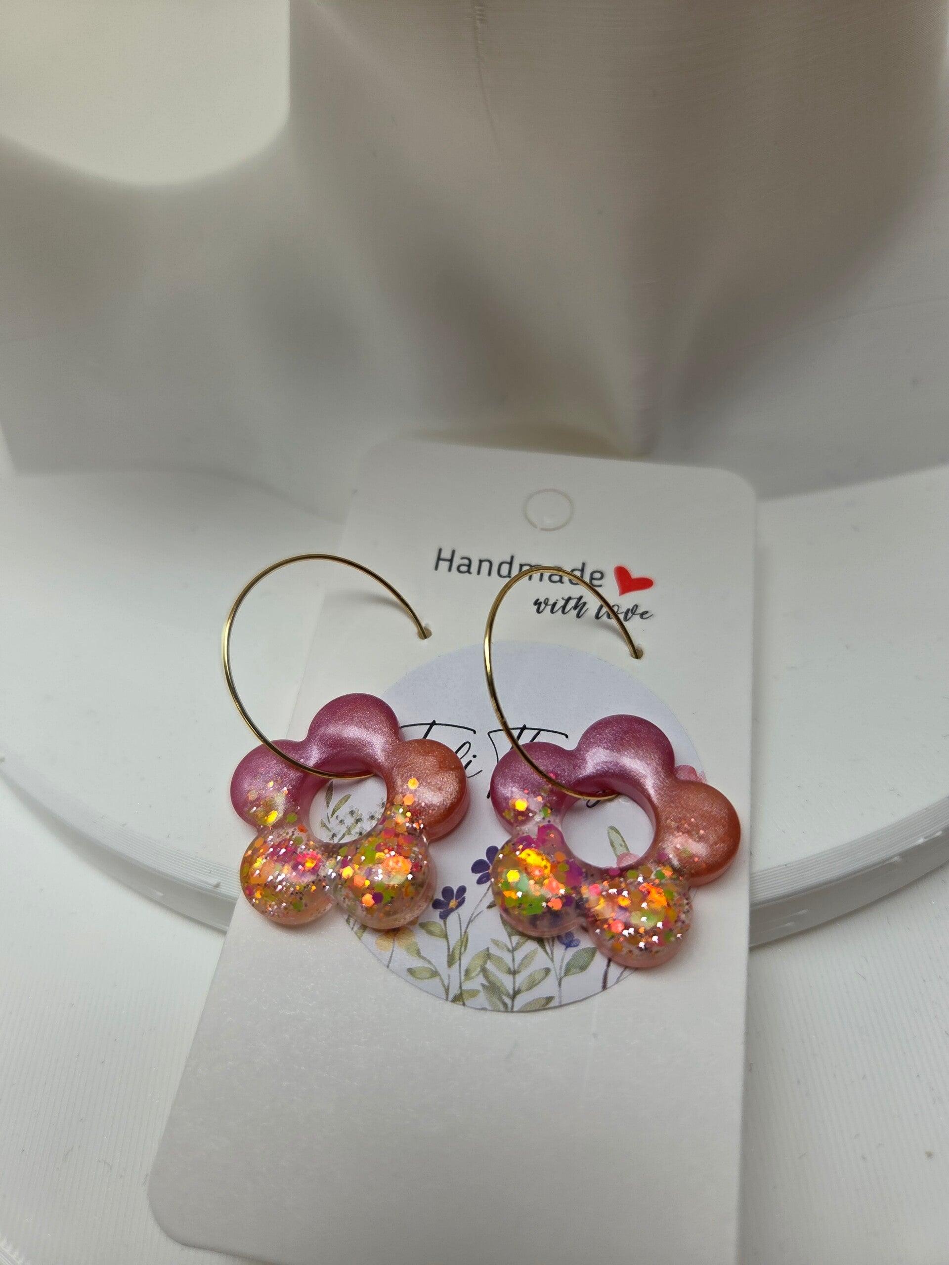 Vrolijke bloemoorbellen roze/koraal met glitters