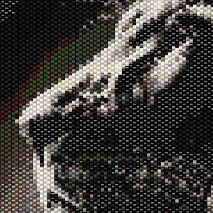 Detailreiches Kreuzstichmuster eines Löwen mit einem Sonnenuntergang, erstellt im Peyote-Stich.