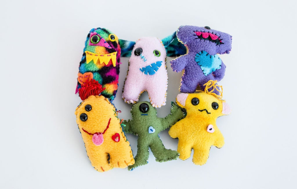 Examples of colorful handmade monsters made from Mini Monster Kits.