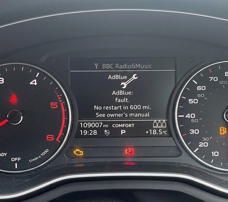 Car dashboard showing AdBlue system fault non-start countdown warning light