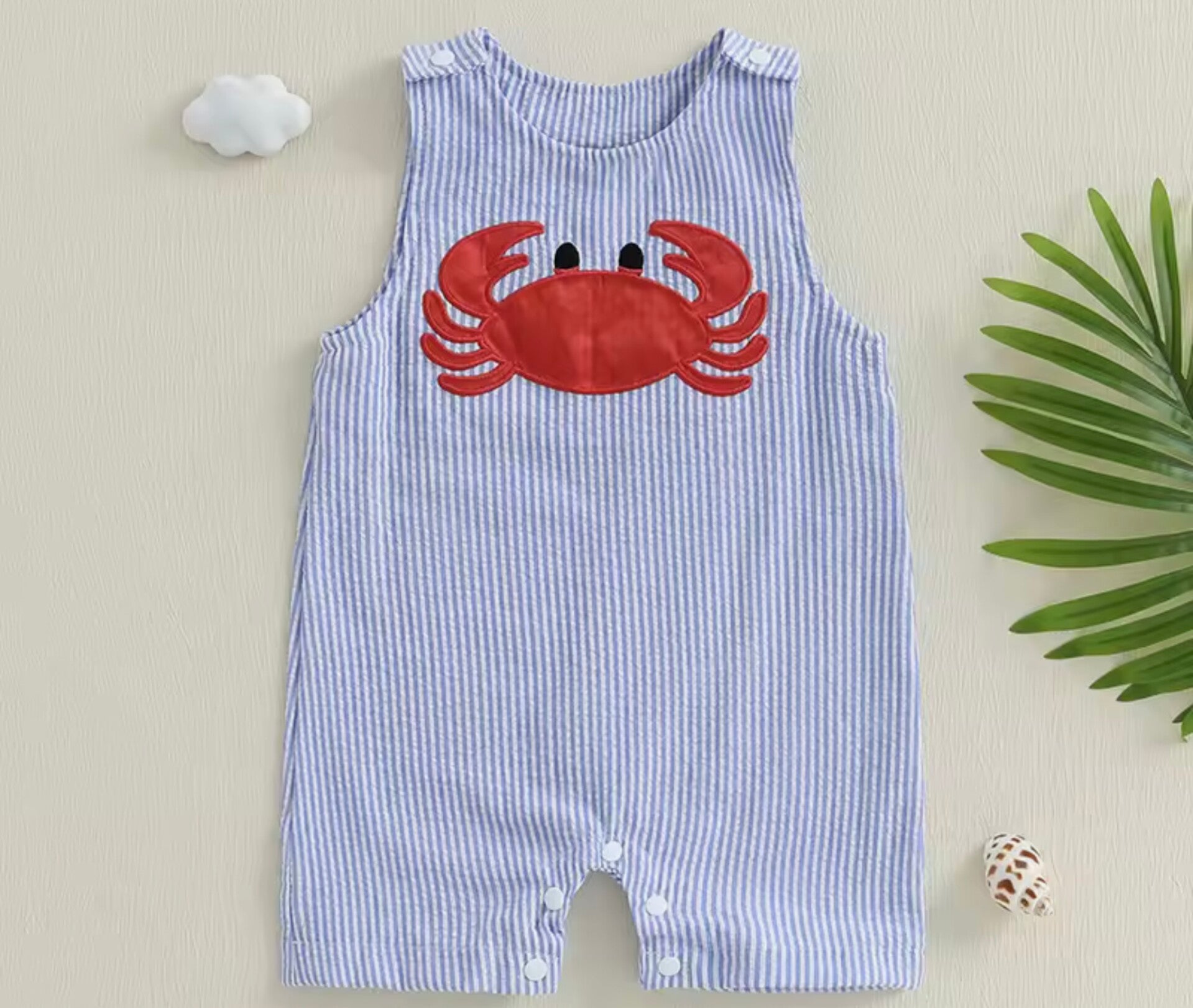 Boys jumpsuit with a seaside crab detail