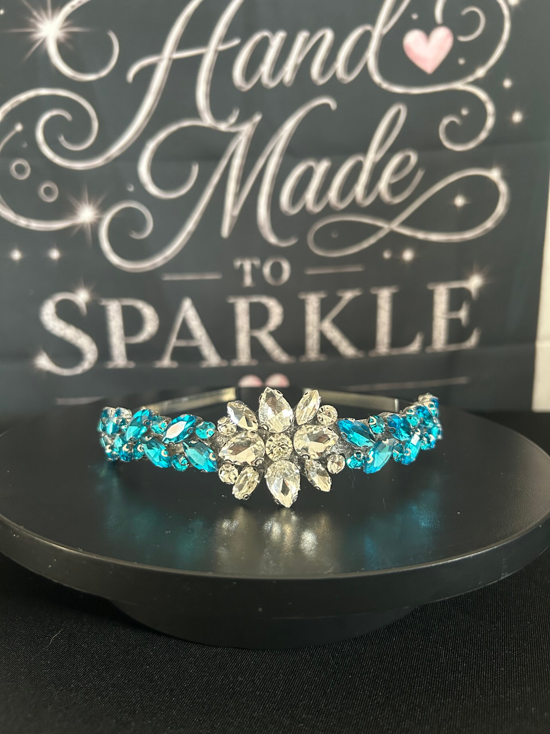 Bright blue headband with centre embellishment